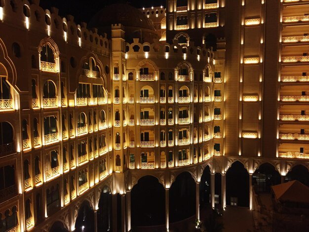 illuminated-al-hamra-palace-beach-resort-night_1048944-1322765